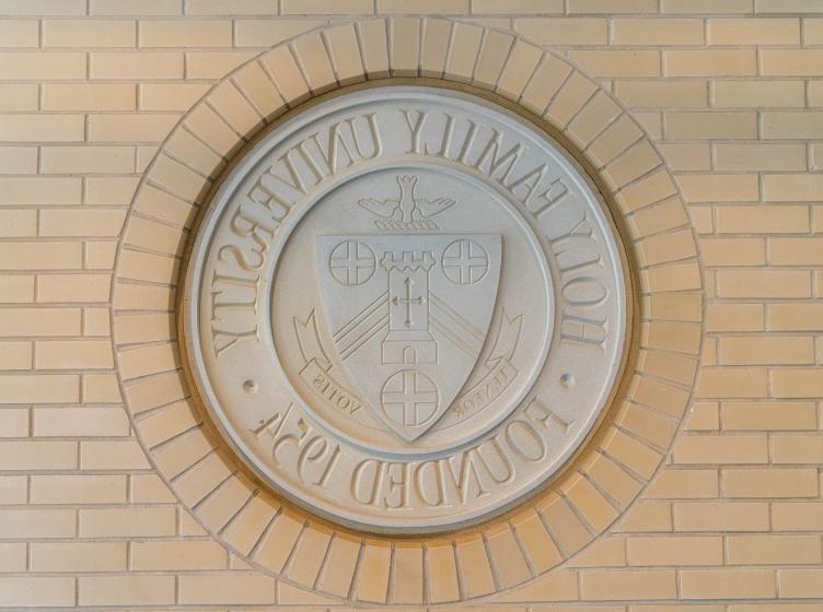 University Seal on brick wall